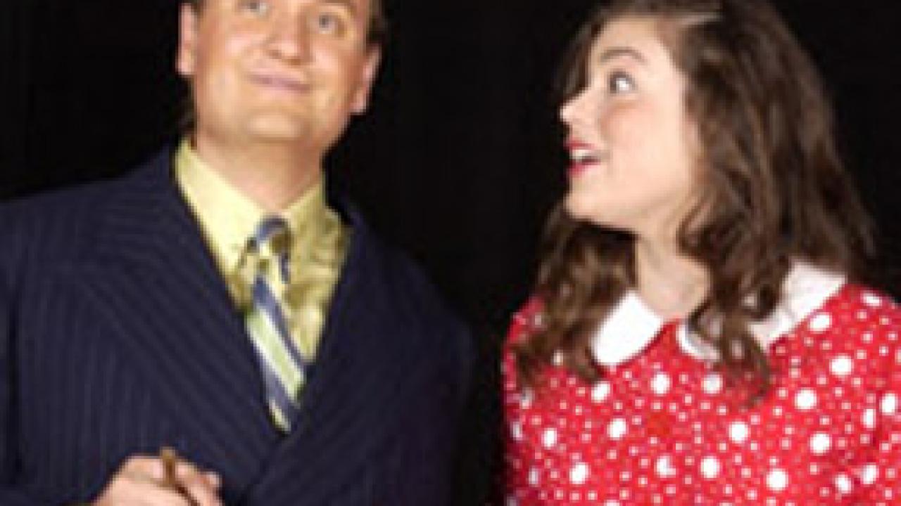 Toilet tycoon Caldwell B. Cladwell (played by Jesse Merz) gives his daughter Hope (Emma Goldin) a lesson on how to 'manipulate great masses of peopl