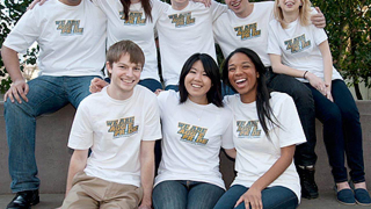 Group of students in T-shirts posing