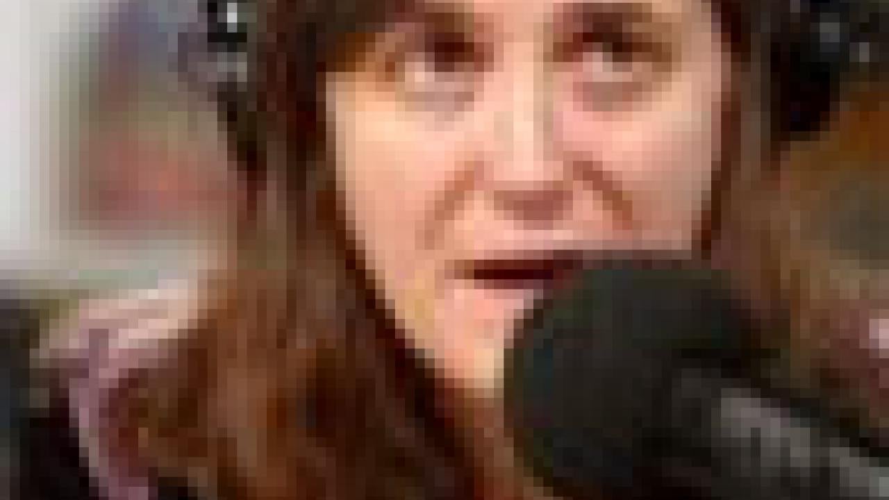 Photo: woman at microphone