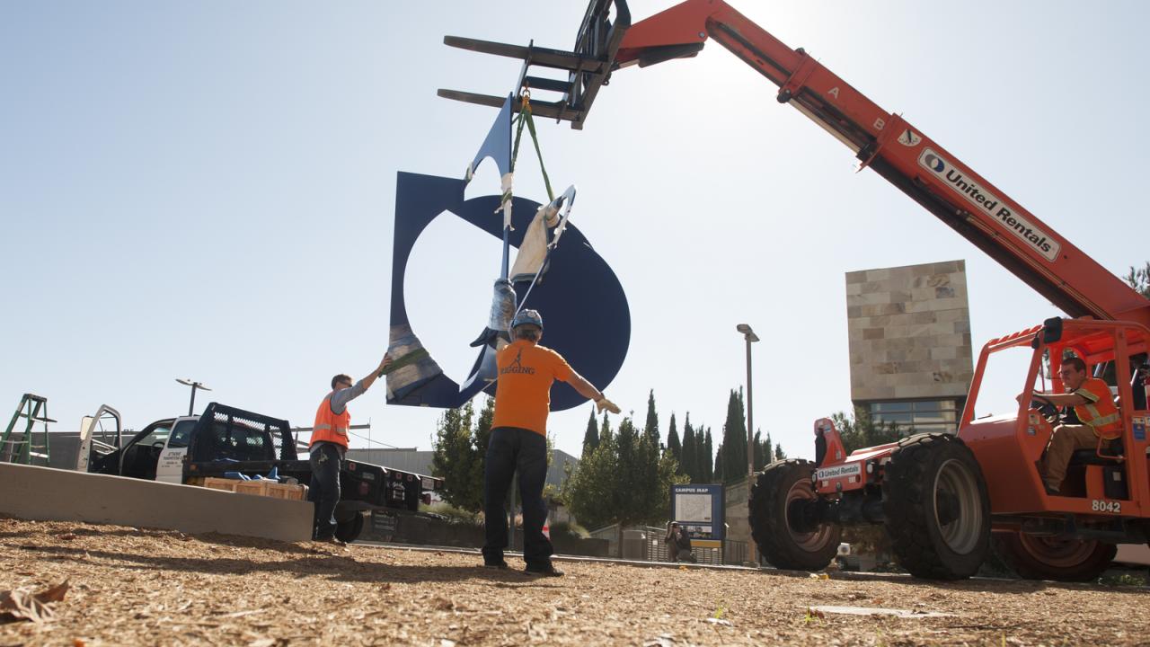 Photo of Folded Square Alphabet D being installed on campus
