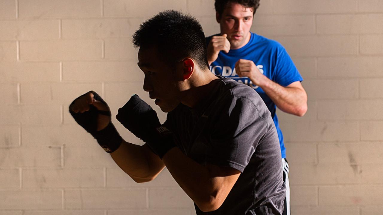 Two men shadow boxing
