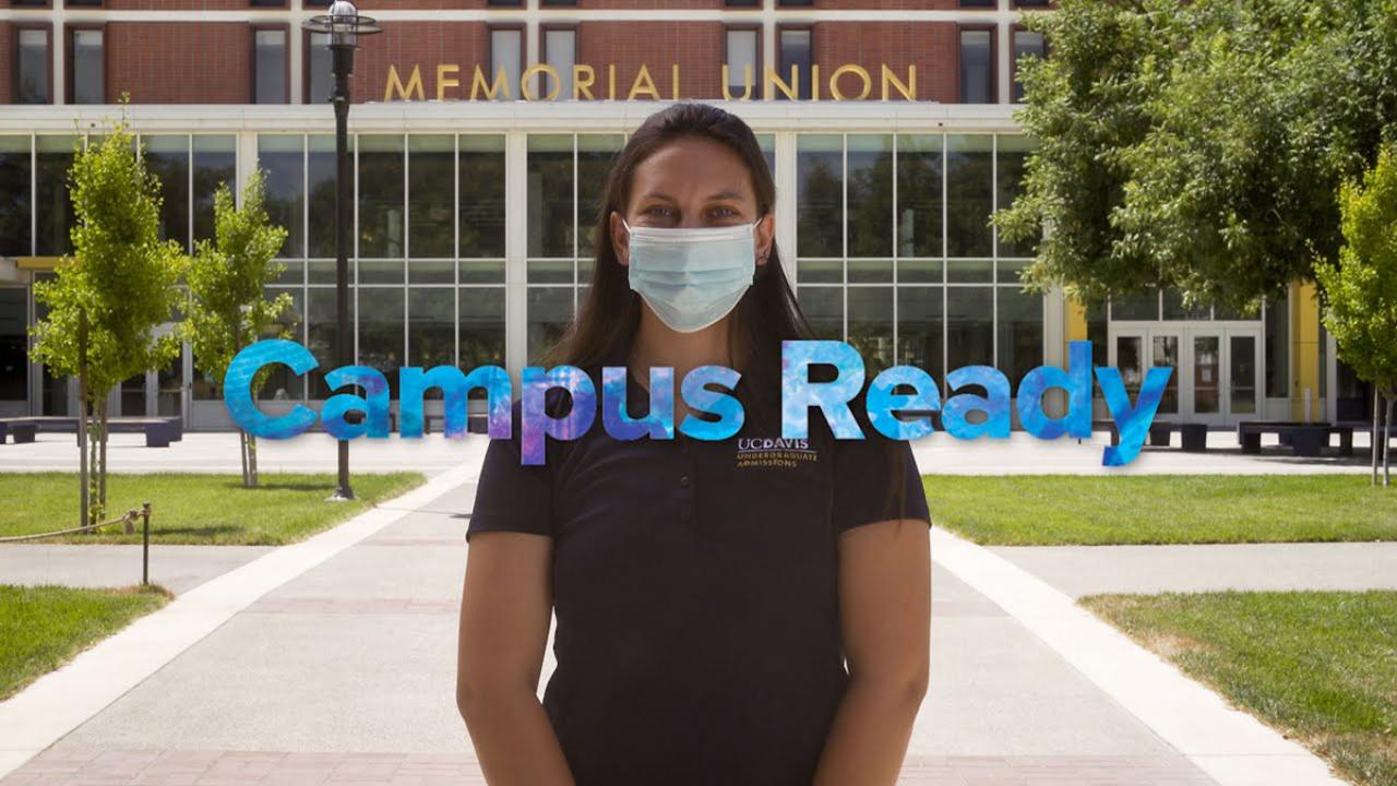 Woman wearing face covering with text "Campus Ready"