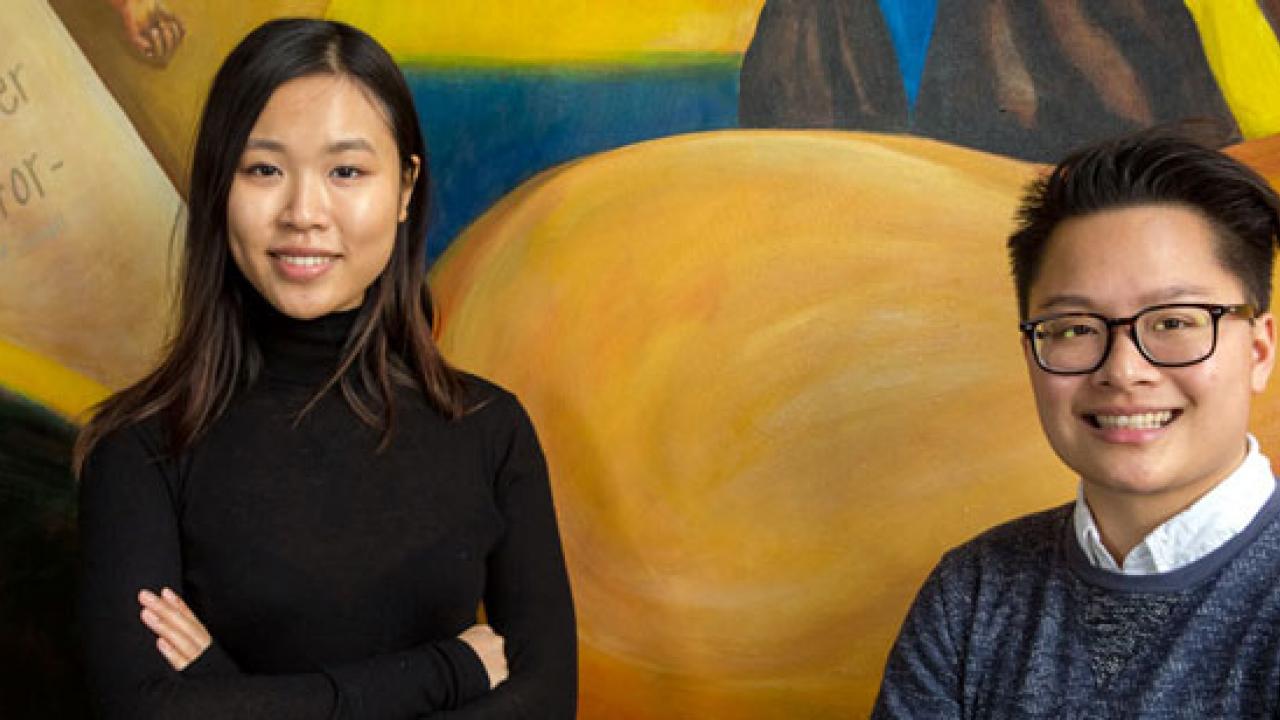 Xinyi &ldquo;Daisy&rdquo; He and Alexandra &ldquo;Alex&rdquo; San Pablo, in front of mural at Student Community Center