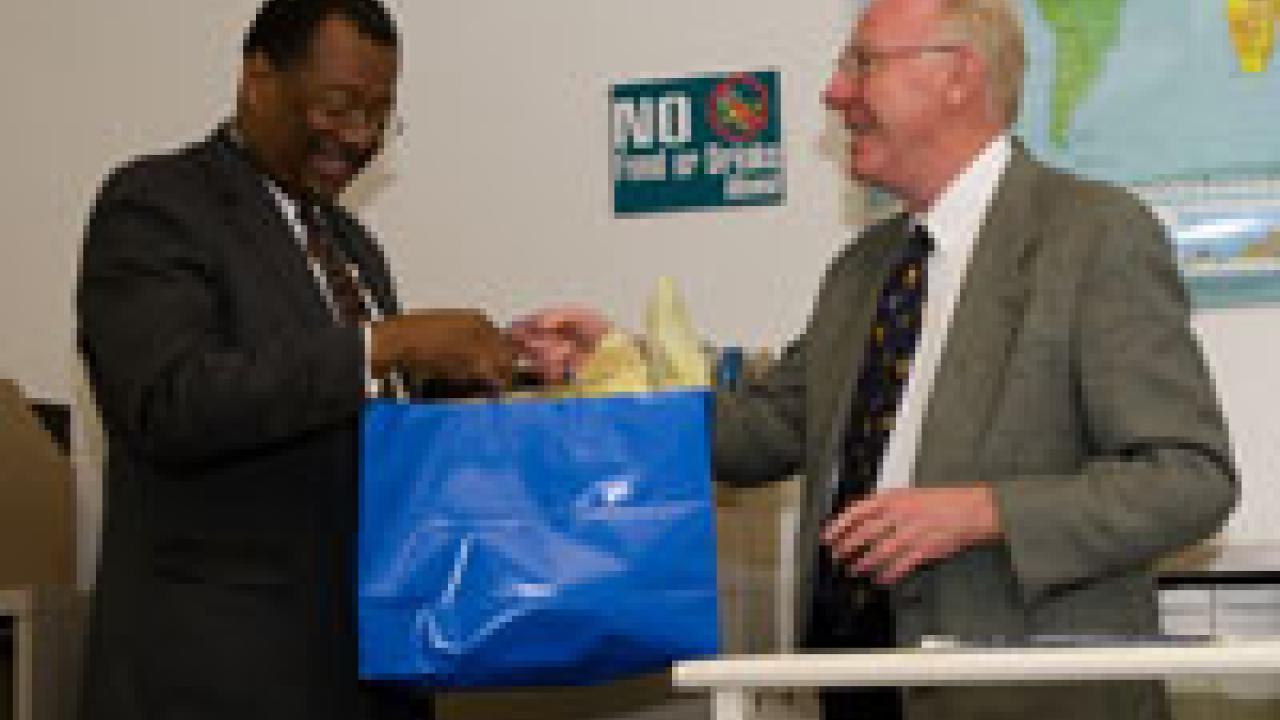 Chancellor Larry Vanderhoef, right, visited the Internship and Career Center on April 12 to present an award to Les McBee, diplomat  in residence from the U.S. State Department.