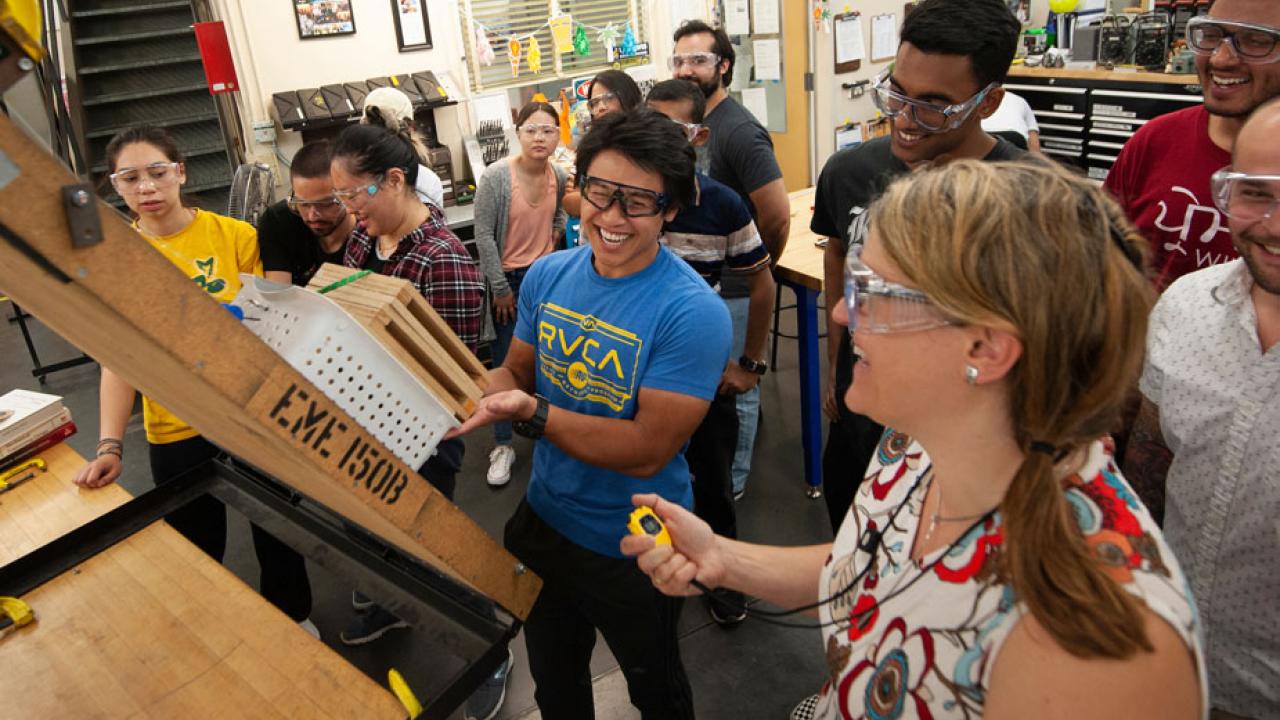 Professor and students participate in a mechanical design contest.