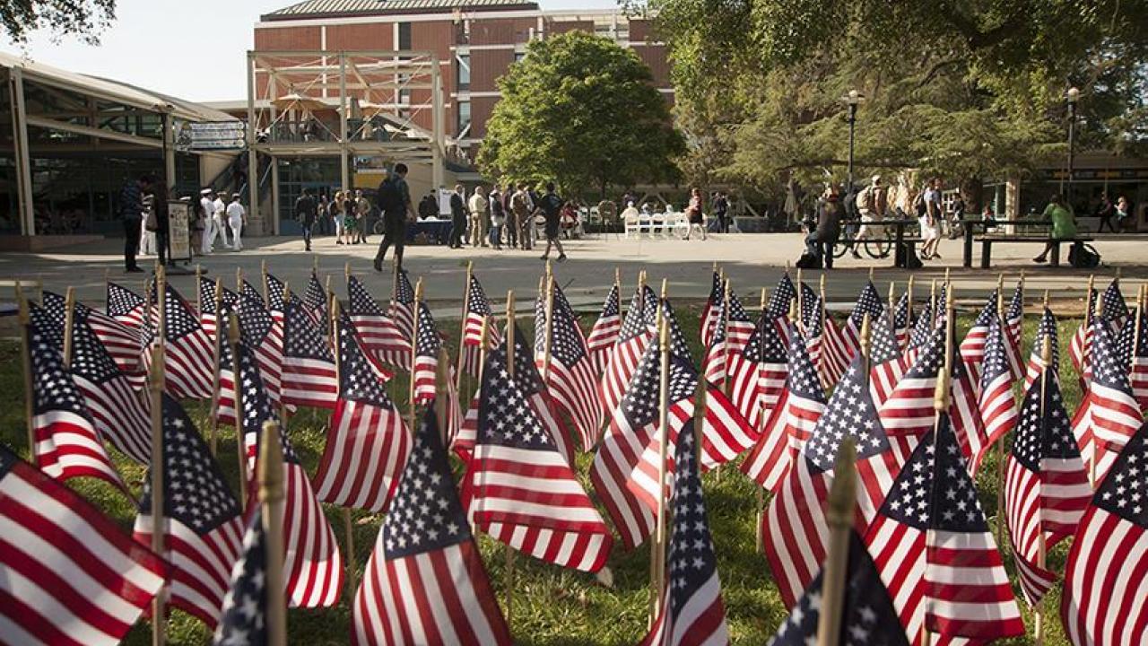 American flag display on the Quad, with the Memorial Union in the background