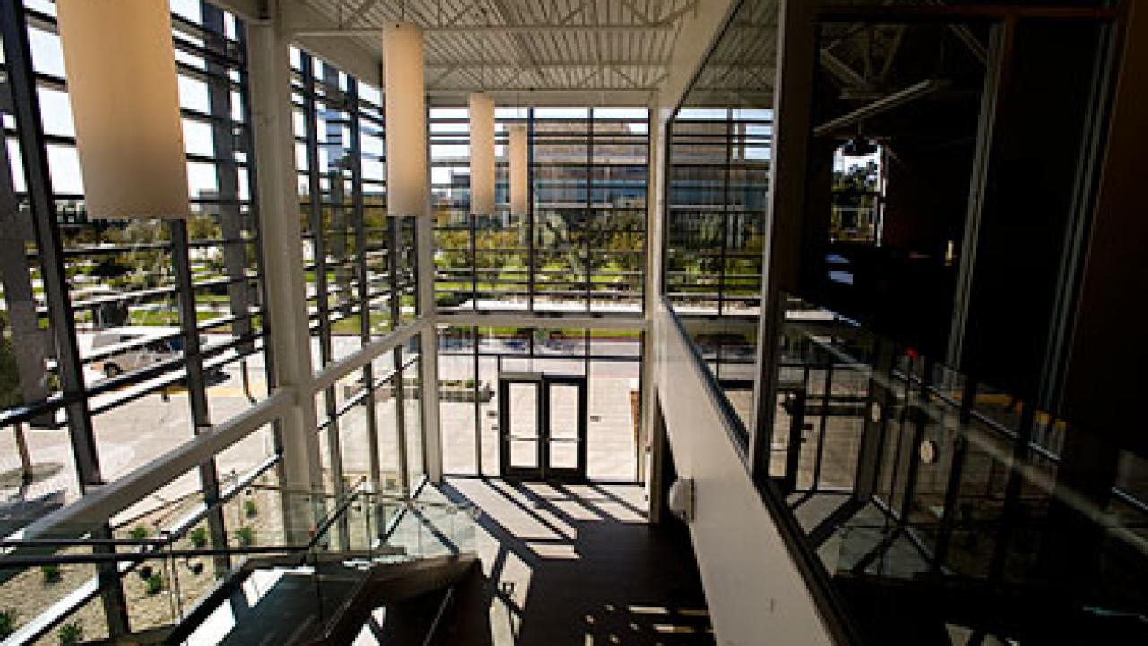 Photo: Inside view of windowed foyer at the new Gallagher Hall, home to the Graduate School of Business
