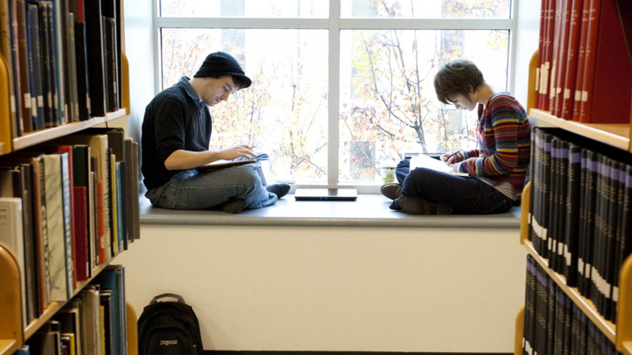 Photo: Two students in Shields Library