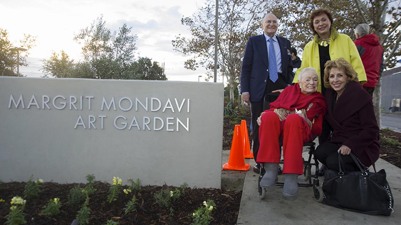 Margrit Mondavi gets her first look at the art garden, under a cloudy sky, Nov. 9, with Chancellor Linda P.B. Katehi, Jan Shrem 