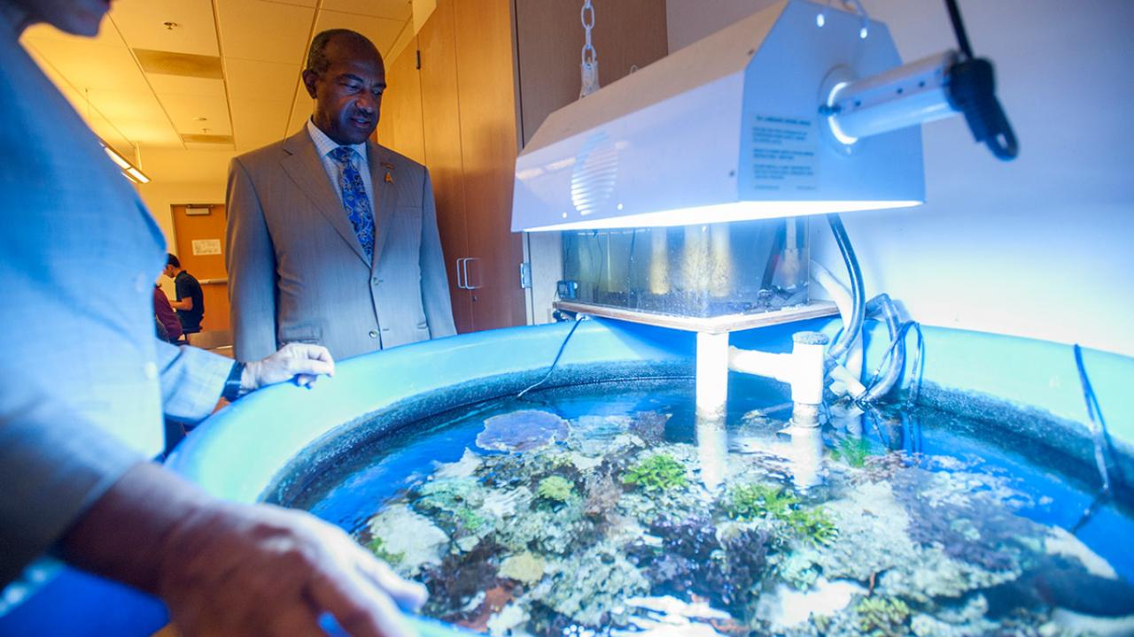 Chancellor Gary S. May visits the College of Biological Sciences.