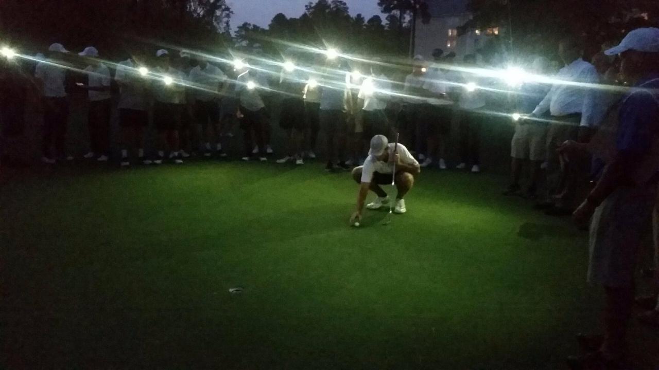 Ben Corfee sets up for a putt at Duke University Golf Club.