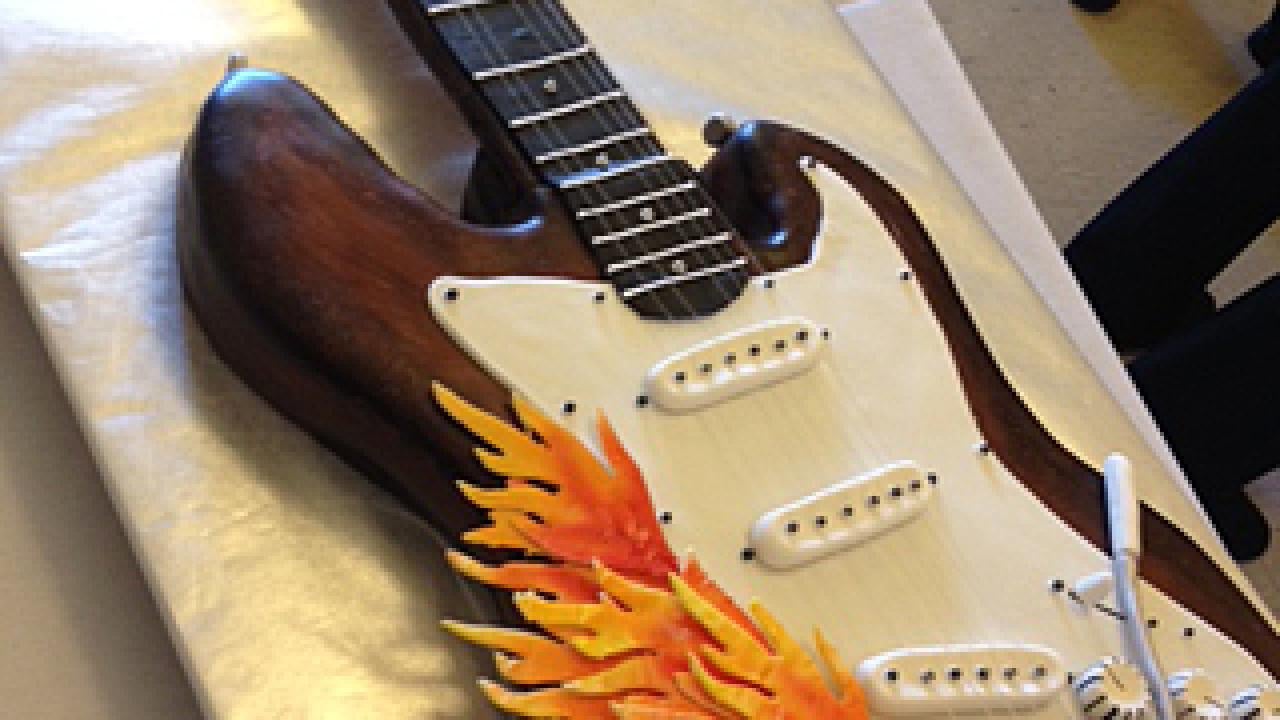 Part of a cake in the shape of an electric guitar