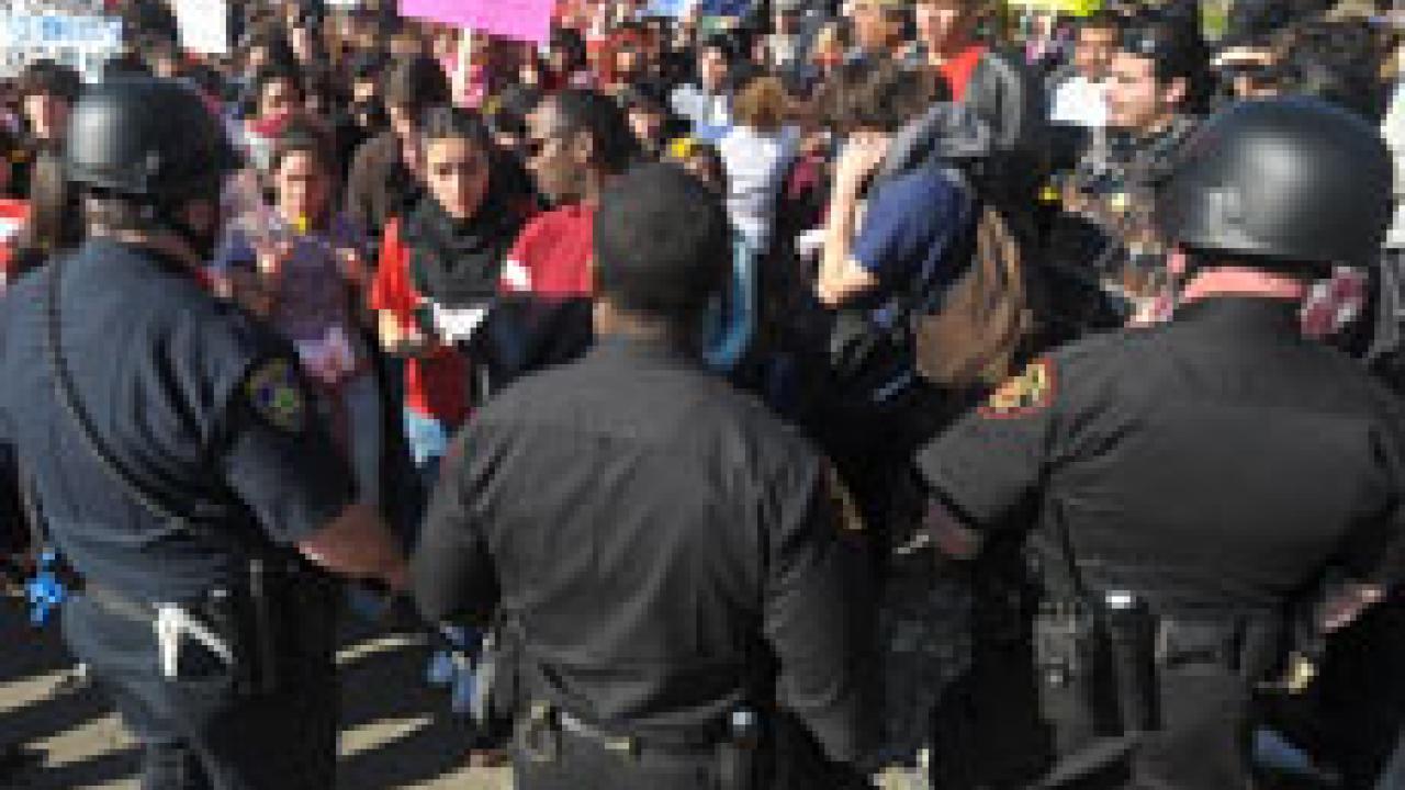 More than 300 students turned out March 4 to protest the decline in state support for UC. Above, students gathered near the Old Davis Road entrance to Interstate 80 before being turned away by more than 120 police officers. One student was arres