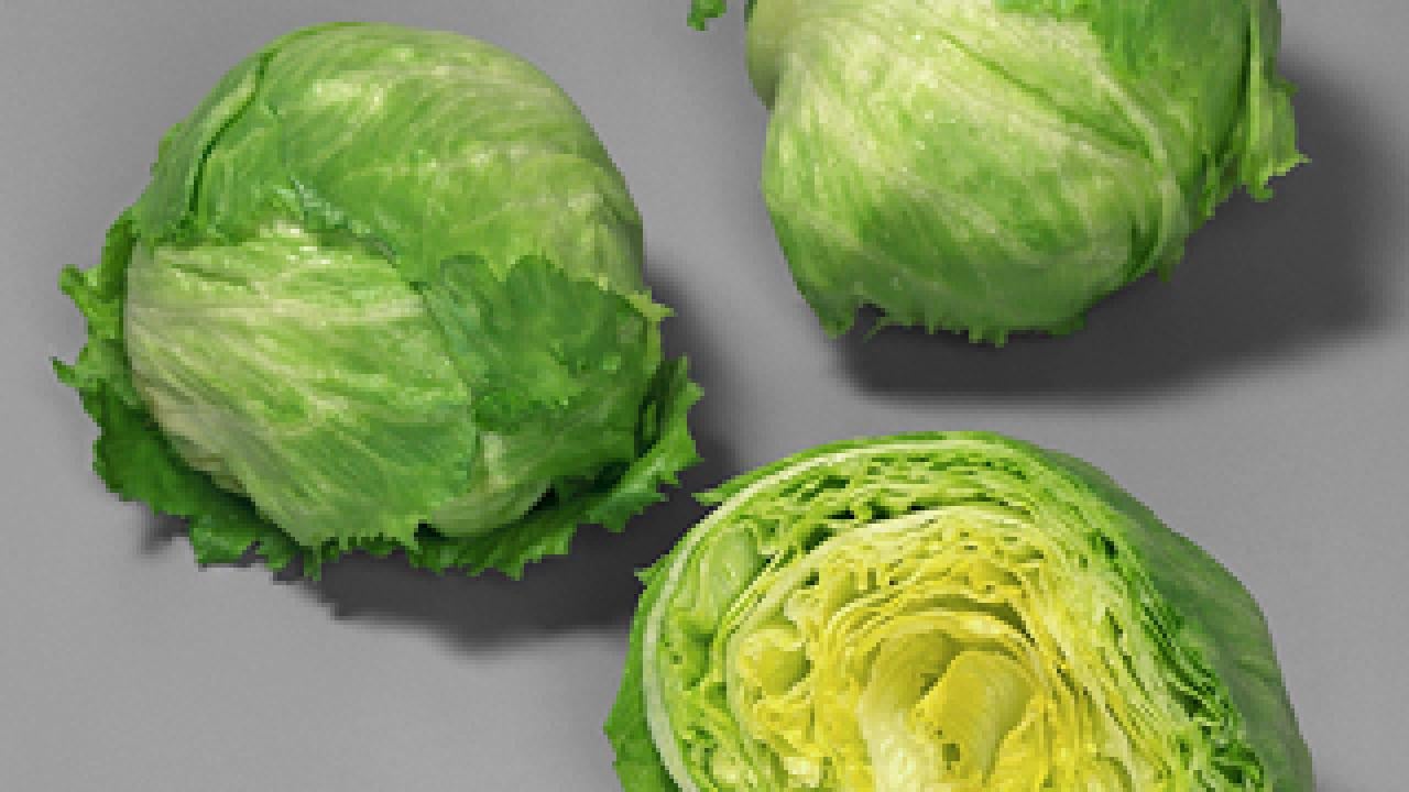 Two full heads of iceberg lettuce and one cut in half