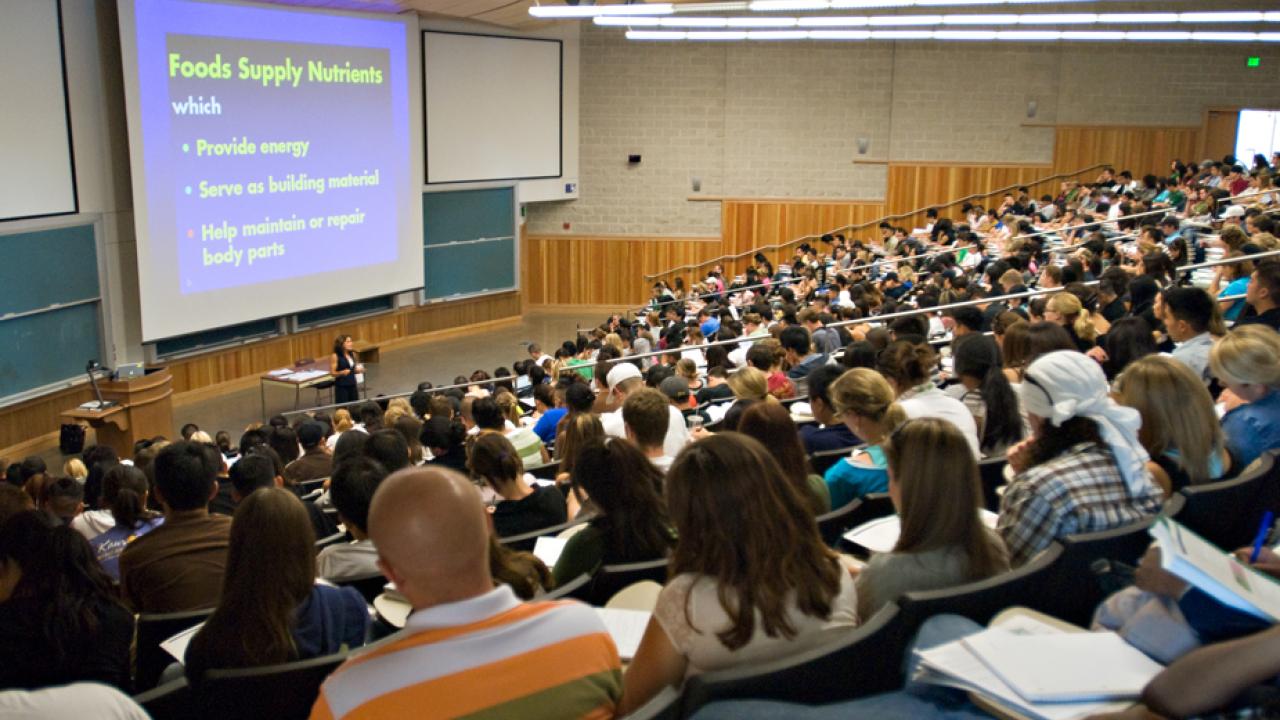 Photo: Students fill lecture hall.
