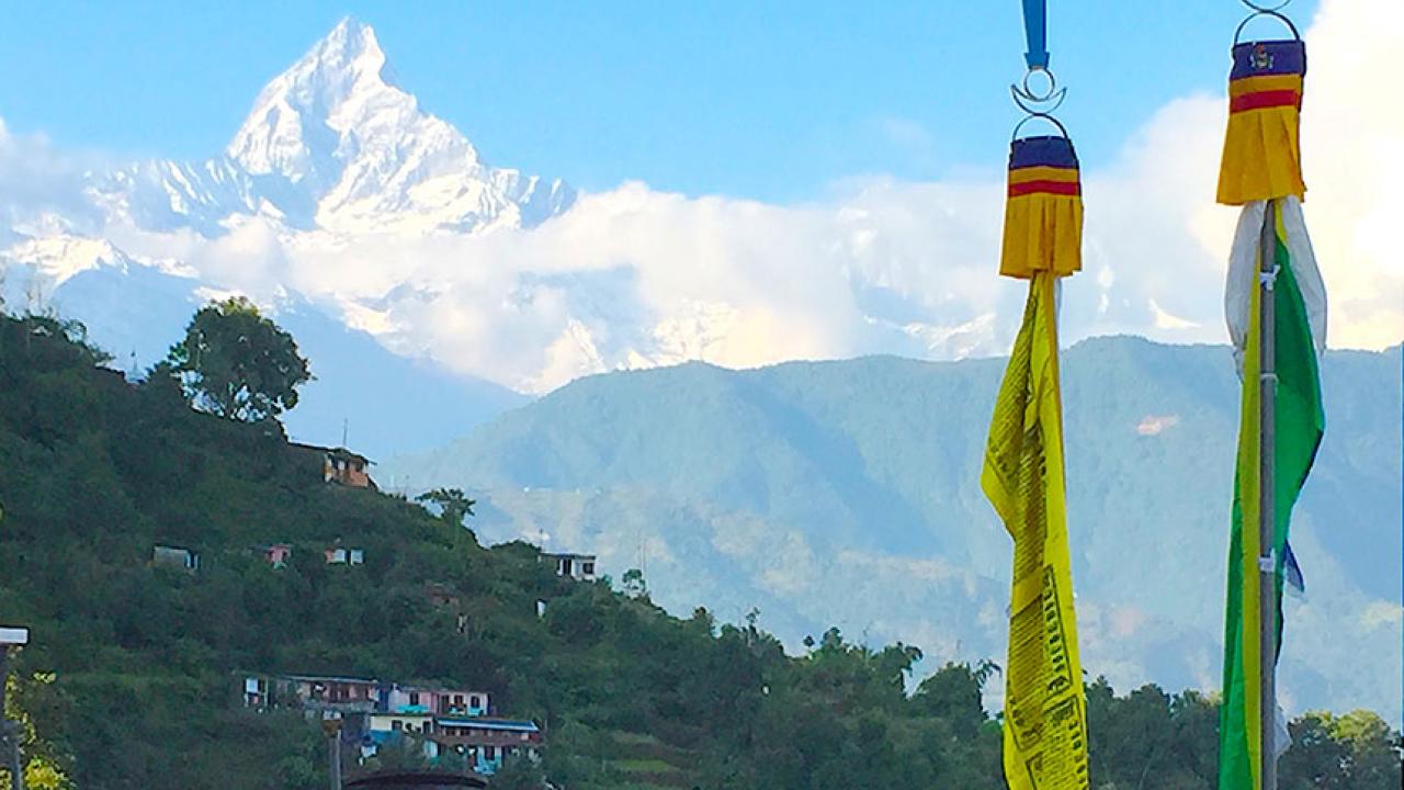 A village against a mountain backdrop in Nepal