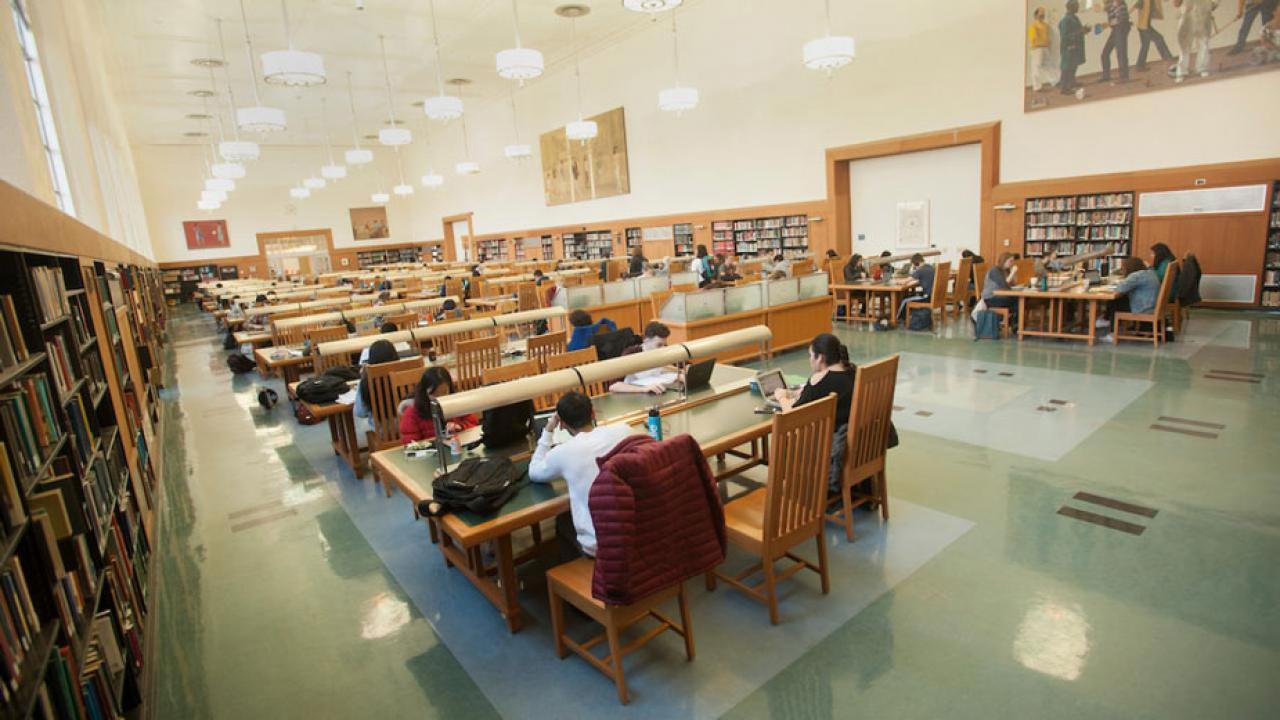 Carenous room at Shields Library, with students seated at study carrels