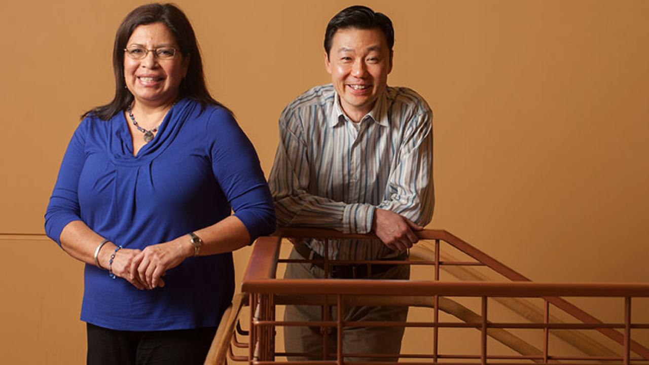Photo: Graduate diversity officers Josephine Moreno and Steve Lee, posing on a stairway