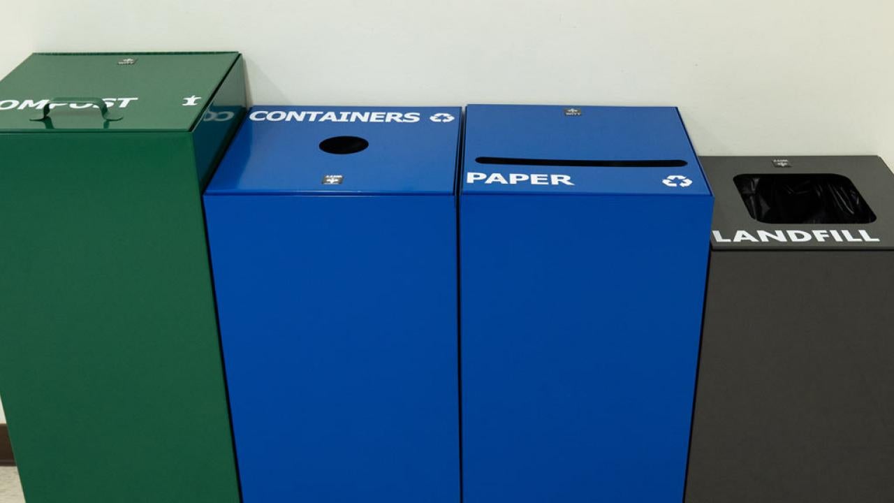 Four waste collection bins