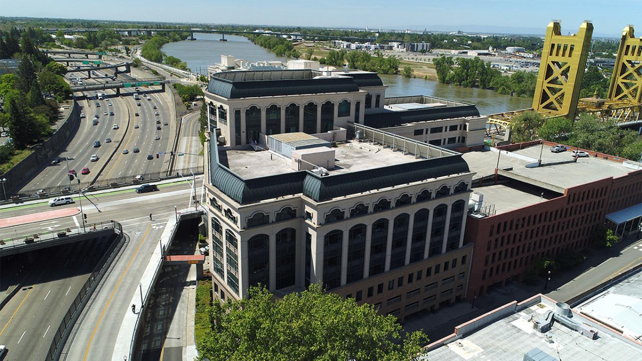 Aerial photo of One Capitol Mall and nearby freeway. 