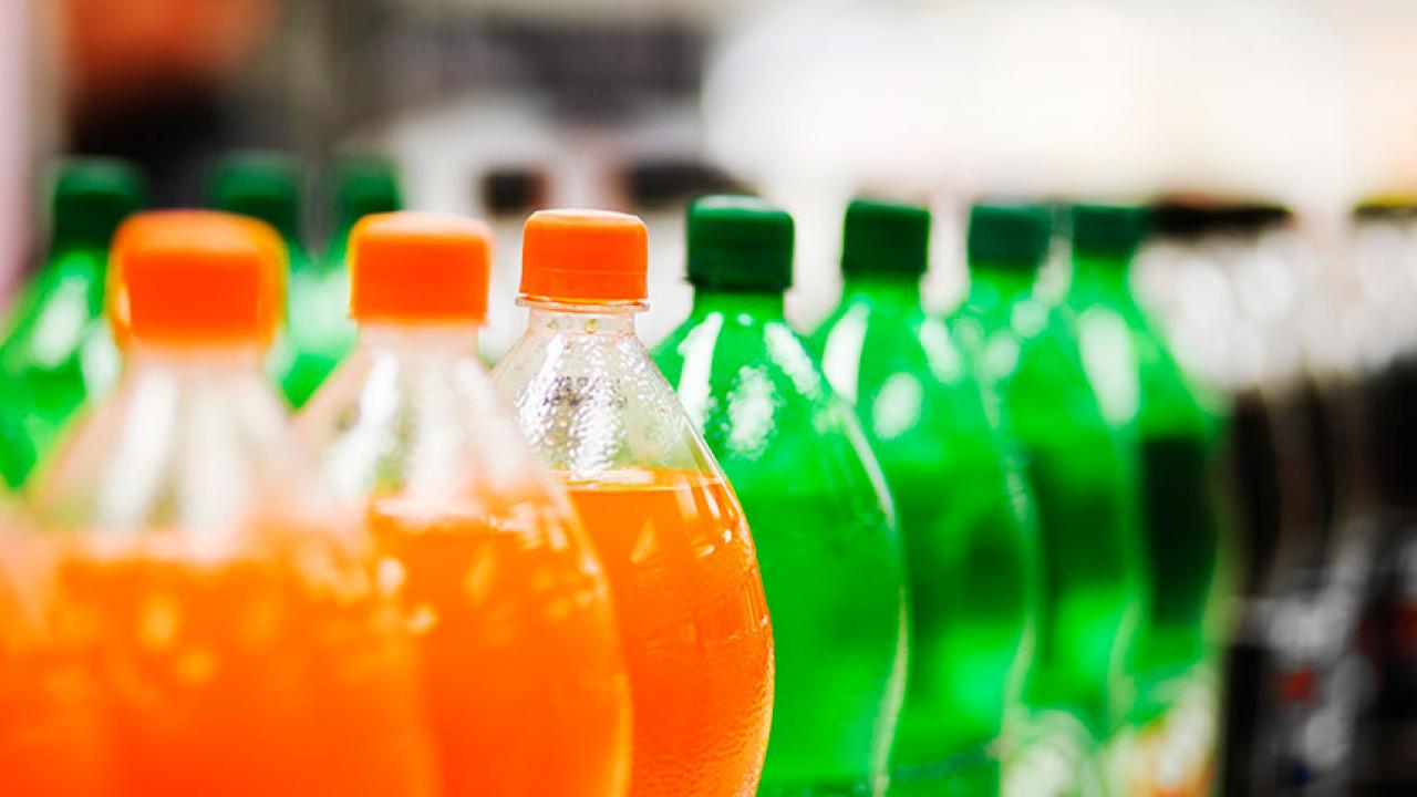 a row of large soda bottles