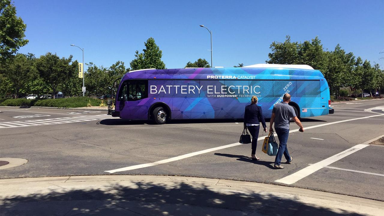 Bus has a wrap that reads "Battery Electric."