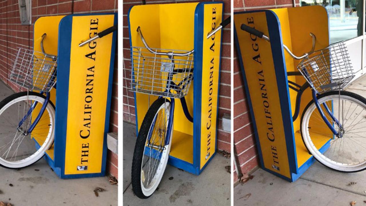 Bicycle with rack incorporated into California Aggie news stand