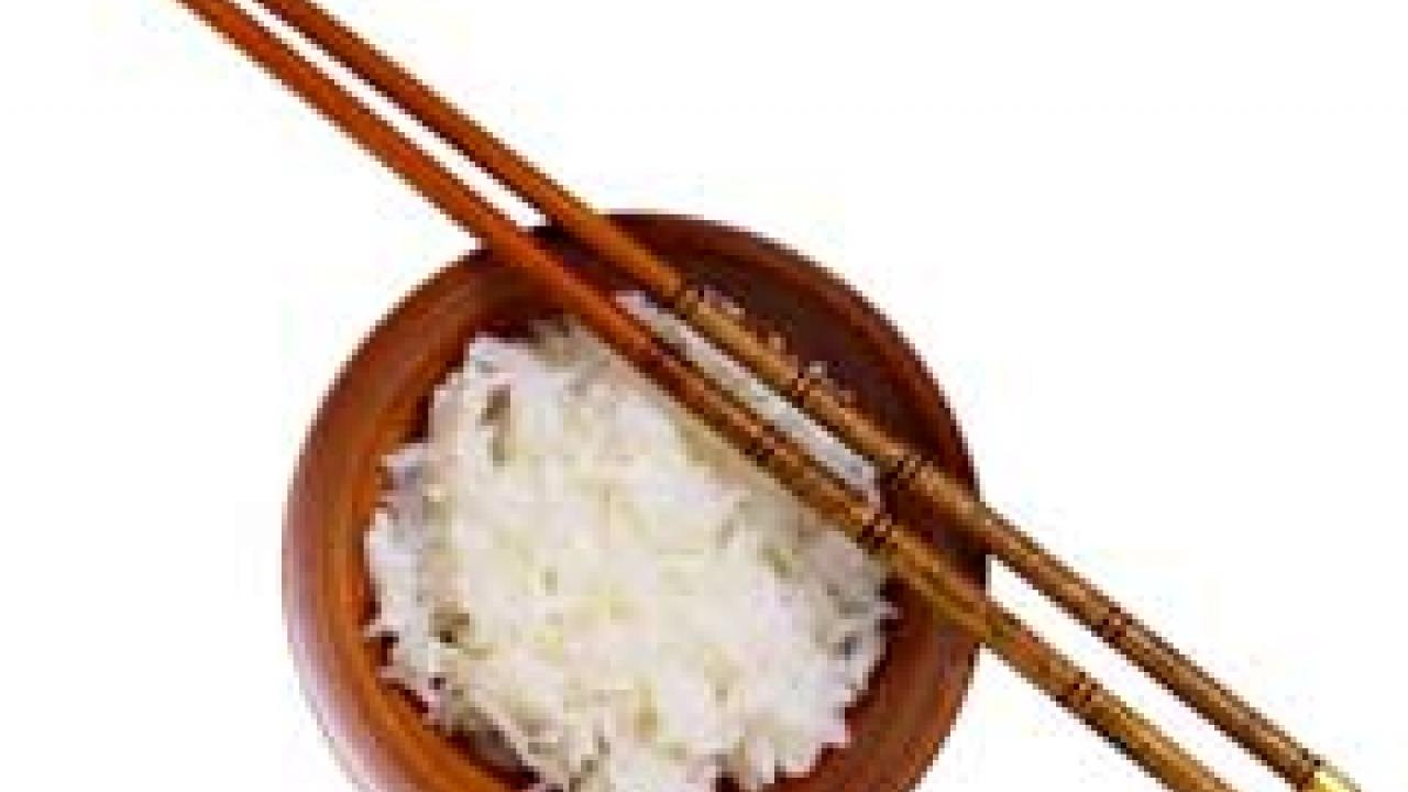 Photo: bowl with rice and chopsticks