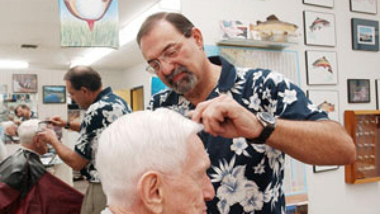 John Salido coifs the hair of Emanuel Epstein, an emeritus professor of Land, Air and Water Resources, who has been having his hair cut by Salido for more than 30 years.  &ldquo;What&rsquo;s on top of the head is never as good as what&rsquo;s inside,&rdquo; Eps