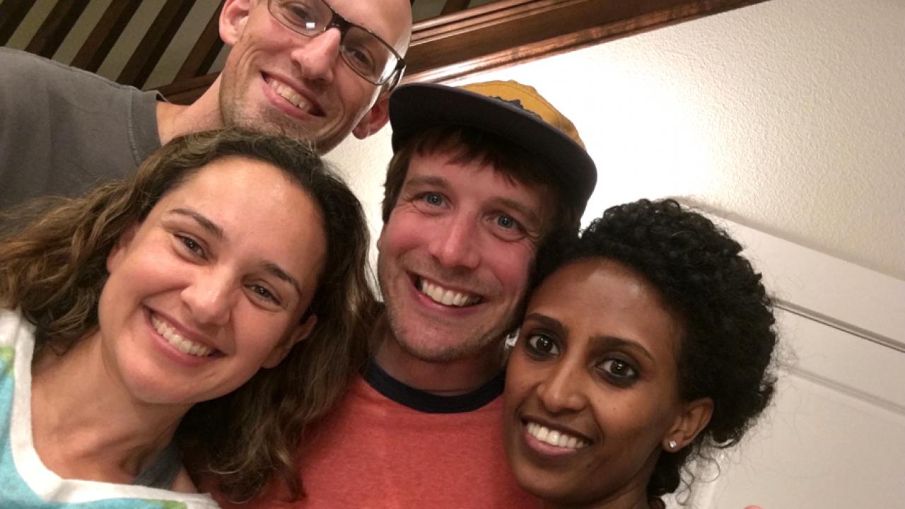 Selfie: four people smiling