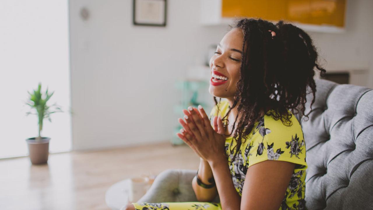 Shena Young environmental, seated on sofa