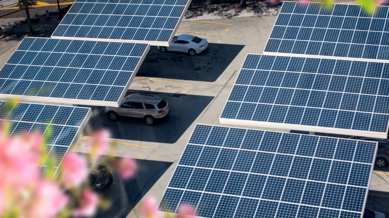 solar panels over cars in parking lot