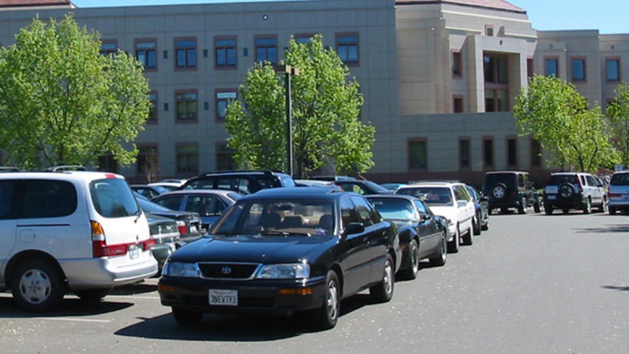 Cars parked in aisle, on top floor of the Quad Parking Structure