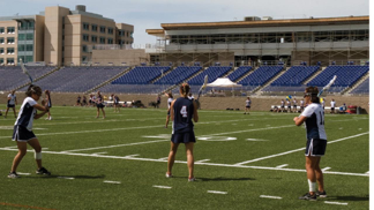 The women's lacrosse team played the first-ever intercollegiate game in the new Aggie Stadium.