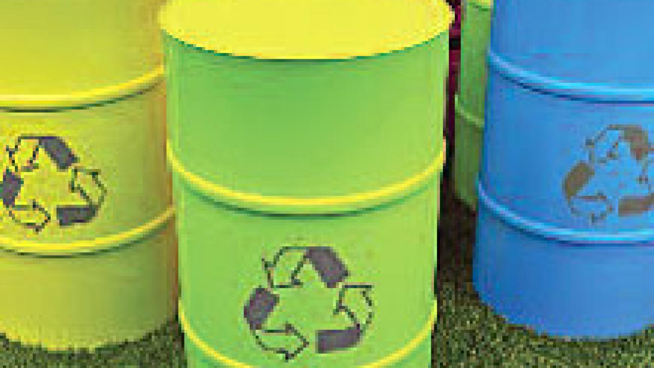 Photo: barrels with recycle symbol