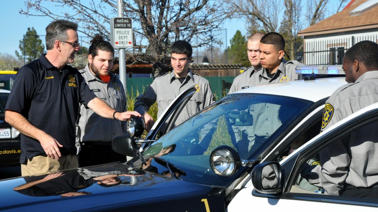 Officer Tim Hunter talks to a group of cadets in 2013.