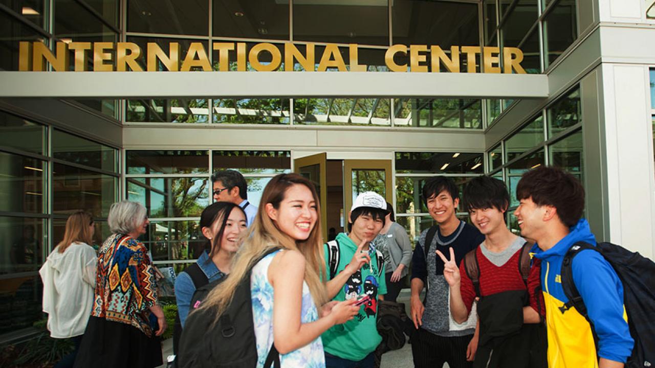 Students talk in front of the International Center at UC Davis