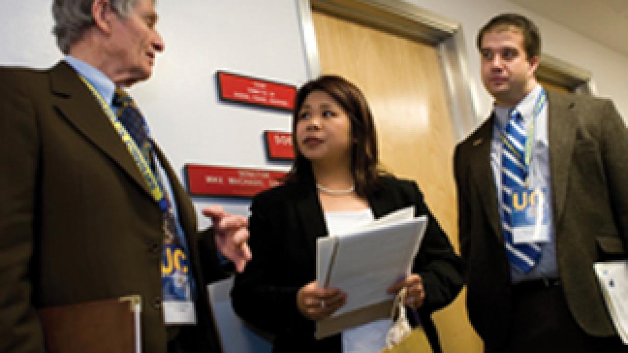Legislative aide Florence Bernal meets with UC Davis alumni delegates Richard Rominger and Brian Micek.