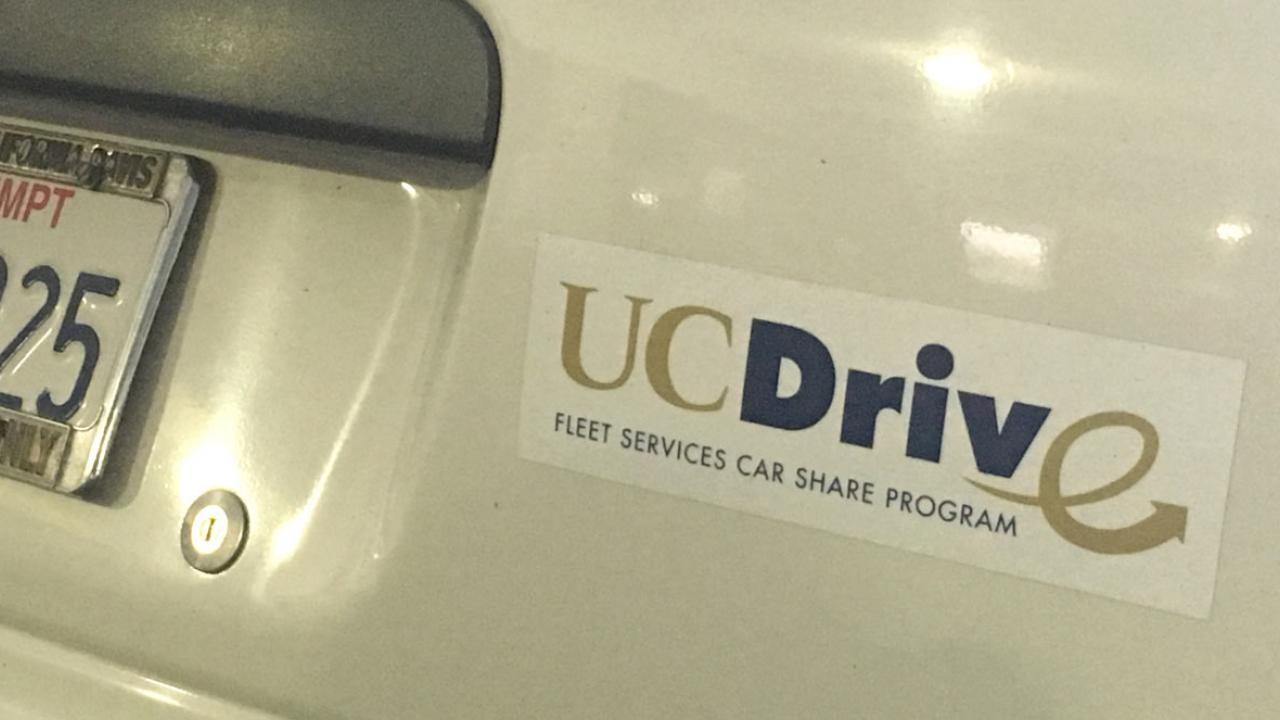 "UCDrive" sticker on back of car.