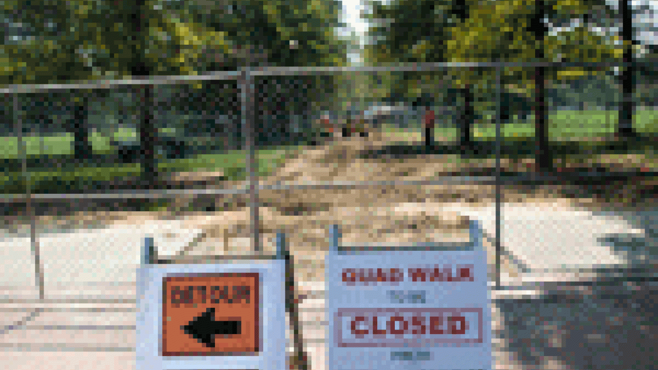 The historic Quad Walk, dating back to around 1915, is closed through mid-October for rebuilding. The new Centennial Walk will be twice the width, at 12 feet, with a circle at the midpoint. Workers fenced off the walkway and tore out the old con