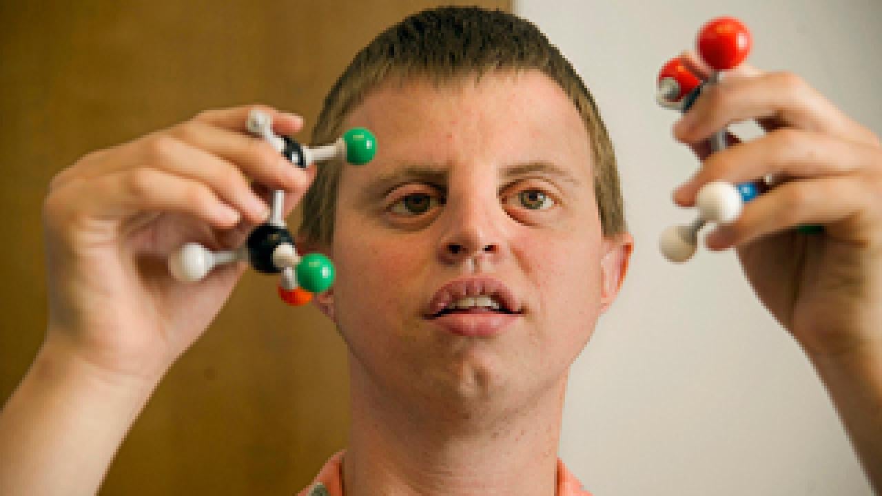 Toby Wedler holds a molecule builder set