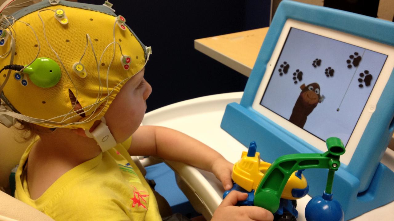Deaf child taking EEG test