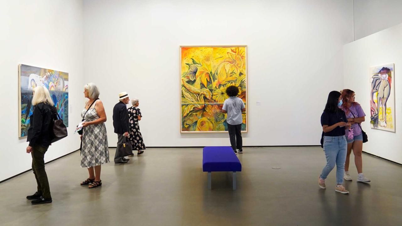 People browing an art gallery at UC Davis museum