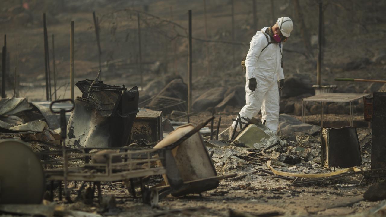 Soldier from National Guard walks through aftermath of Camp Fire in Paradise, California in 2018