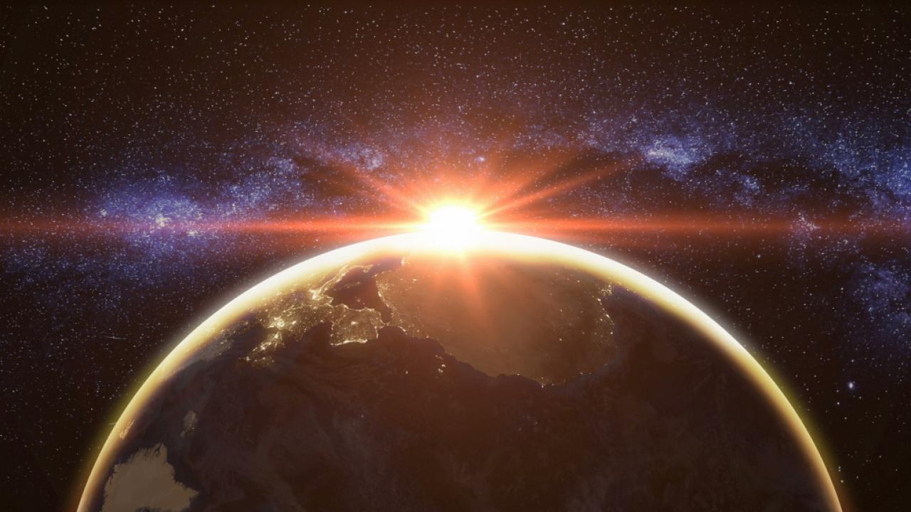 Stock image of sunrise over planet Earth, seen from space