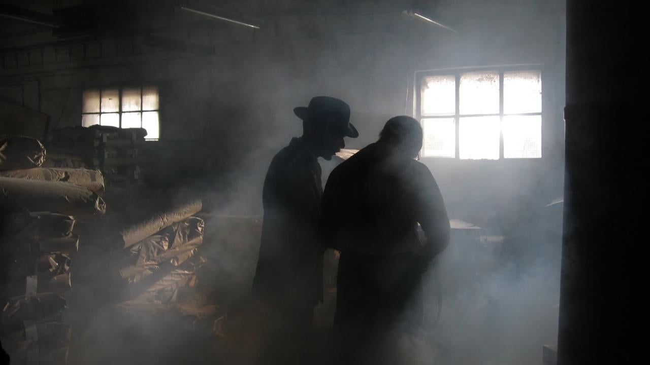 Men in smoke-filled room