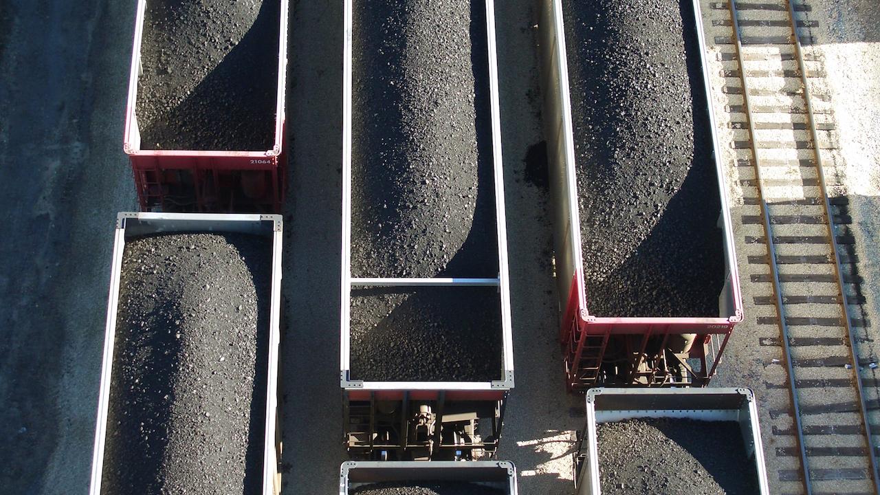 aerial view of trains full of coal in open air