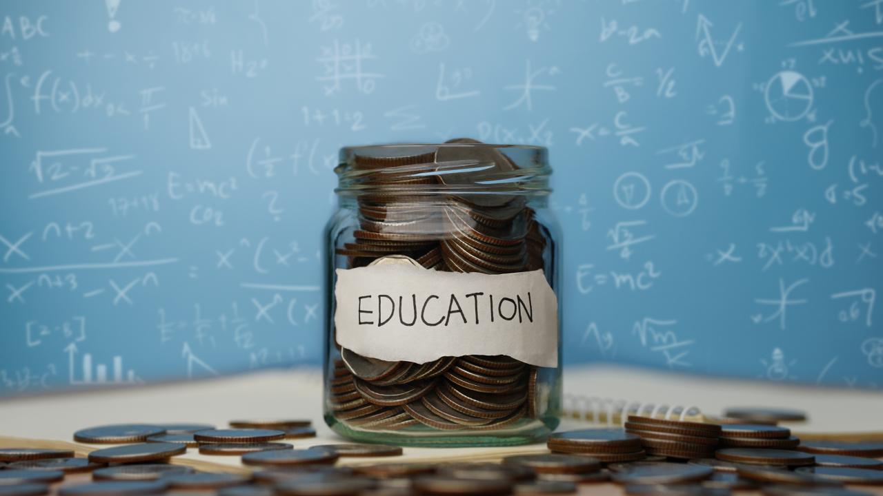 Jar of coins representing education funding
