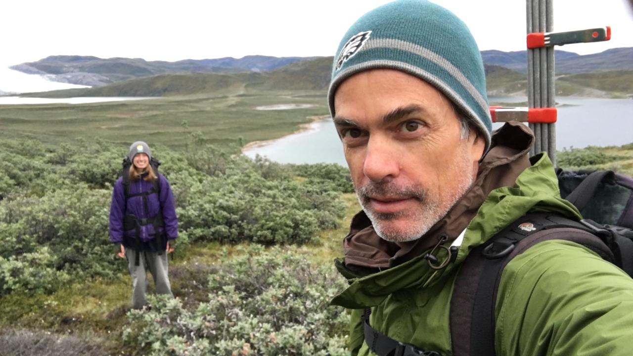 Eric Post takes selfie at his field site in Arctic Greenland, his daughter in the background