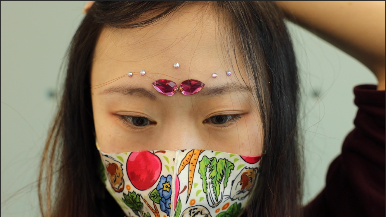A demonstration of the team's facial jewelry device. Photo courtesy of Shuyi Sun.